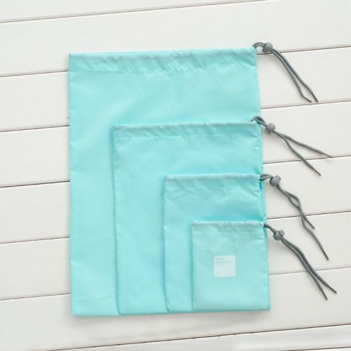 Light blue 4 piece organiser laid  flat showing size differences