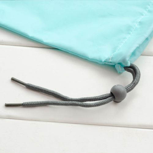 Toggle clip for drawstring cord on light blue travel pouch
