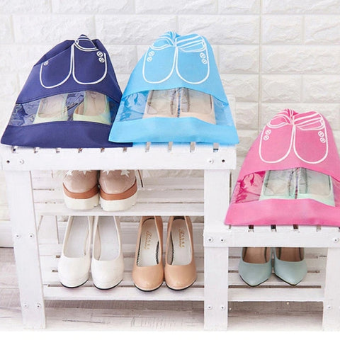 Shoes inside blue and pink shoe pouches sitting neatly on a rack