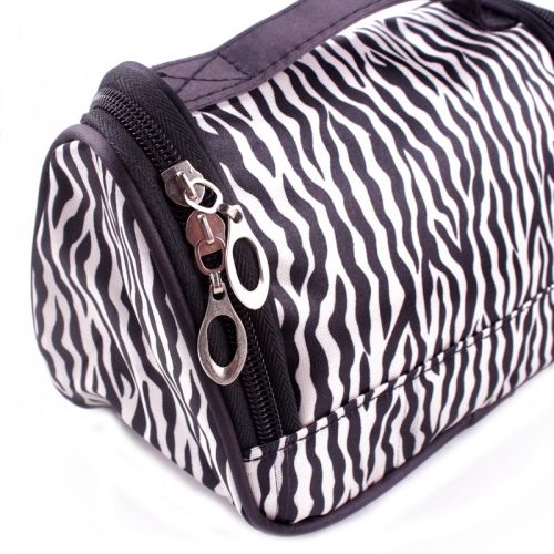 The zips of the zebra print makeup bag