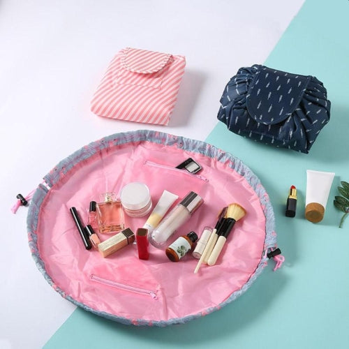 Grey flamingo scrunch up makeup bag laid out flat with cosmetics inside